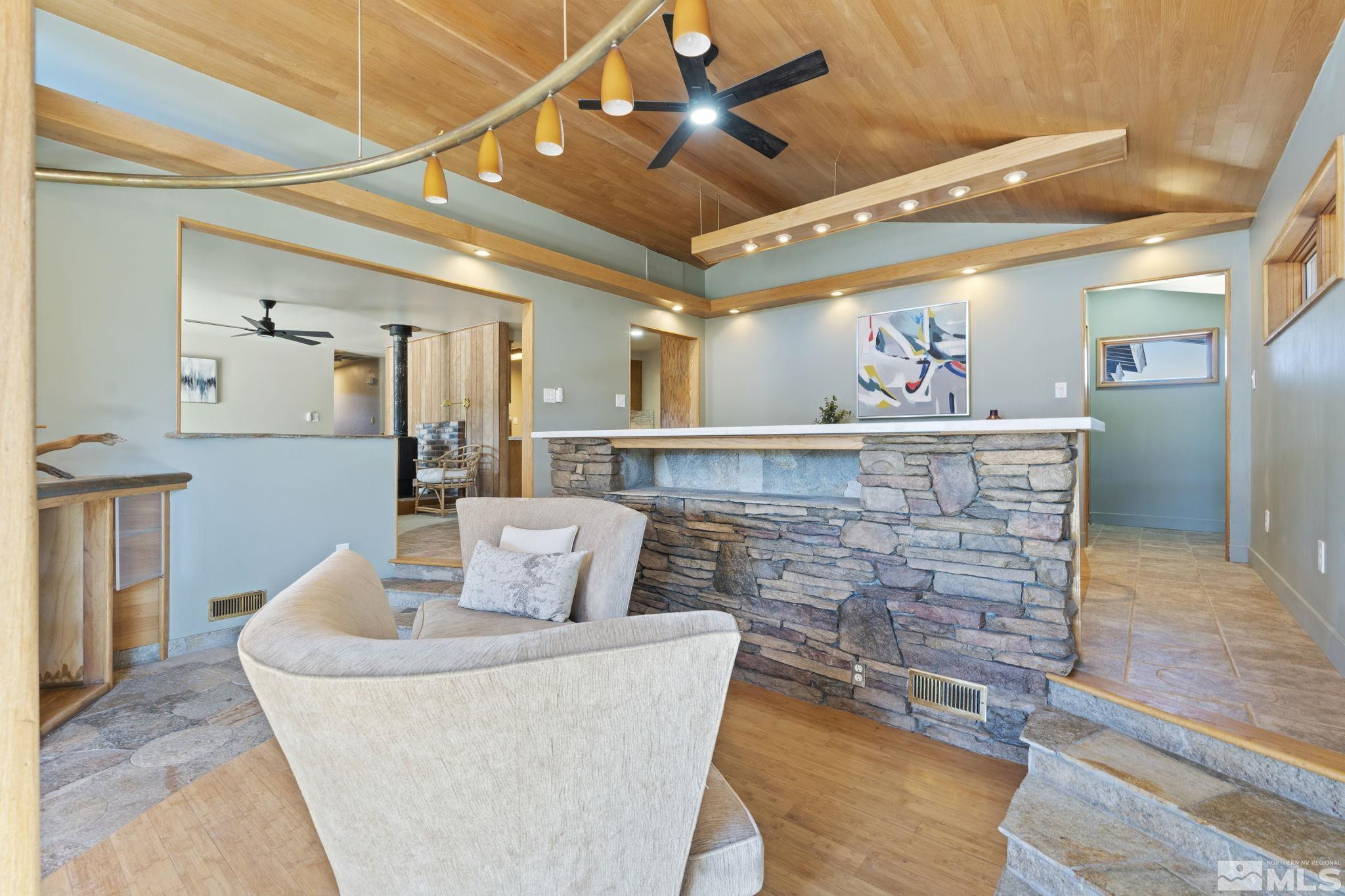 888 Dresslerville Road Gardnerville, NV 89460 - Photo 14 of 35 a living room with furniture and a chandelier