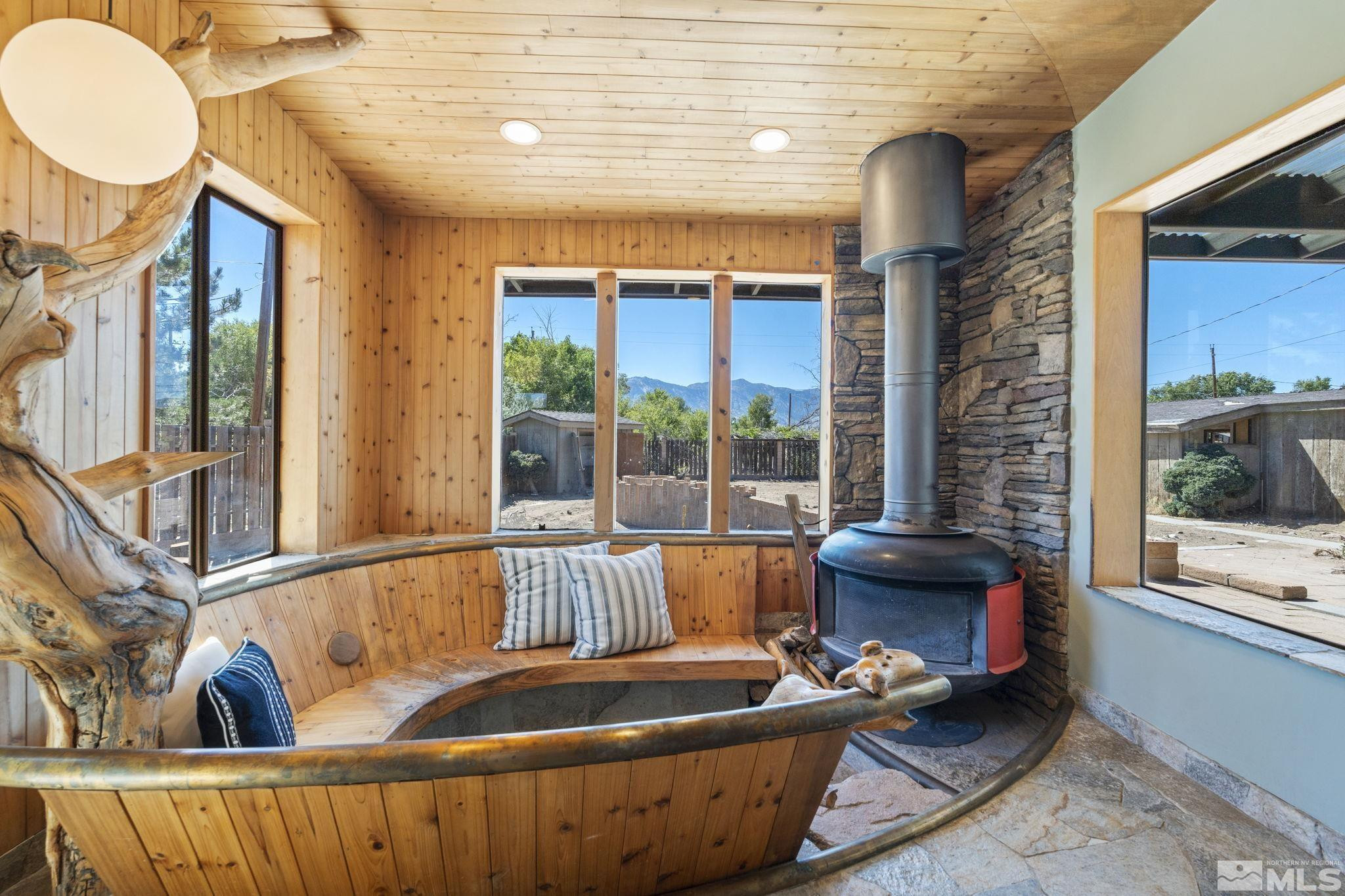 888 Dresslerville Road Gardnerville, NV 89460 - Photo 17 of 35 a living room with furniture and a floor to ceiling window