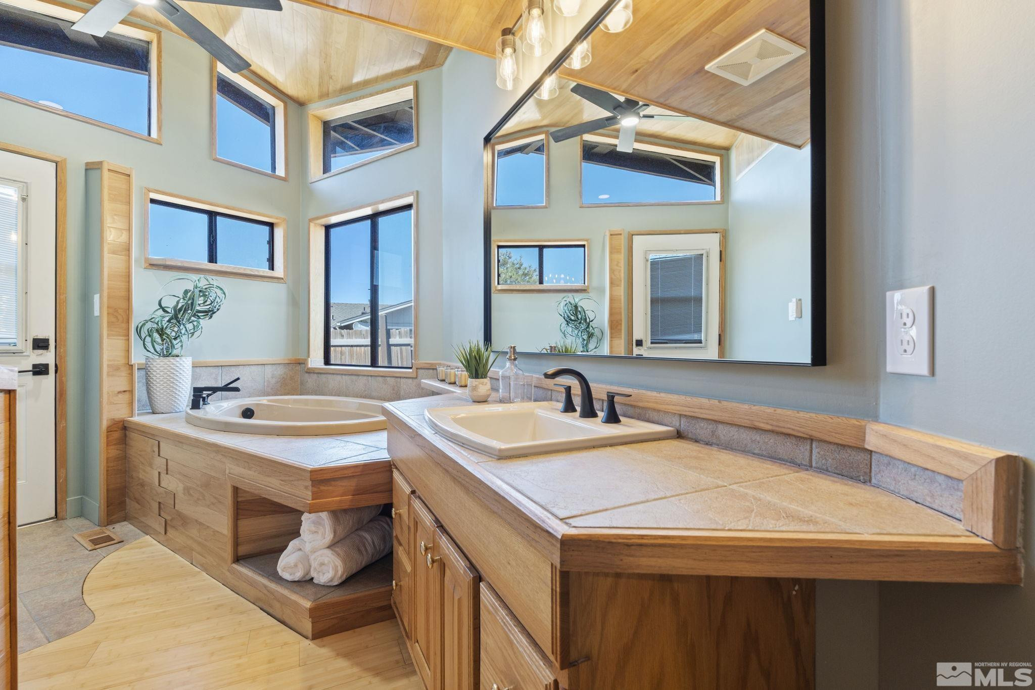 888 Dresslerville Road Gardnerville, NV 89460 - Photo 22 of 35 a bathroom with a sink and a mirror