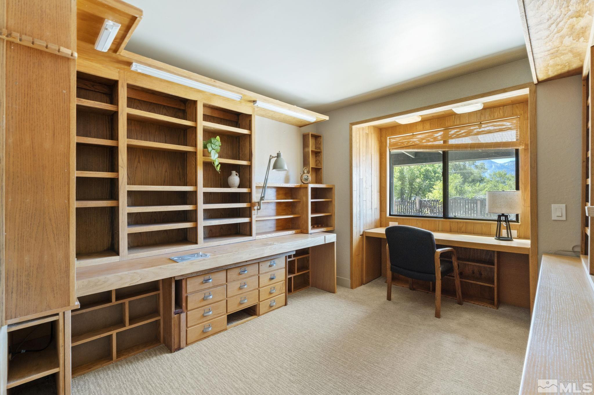 888 Dresslerville Road Gardnerville, NV 89460 - Photo 23 of 35 a view of a workspace with furniture and a window