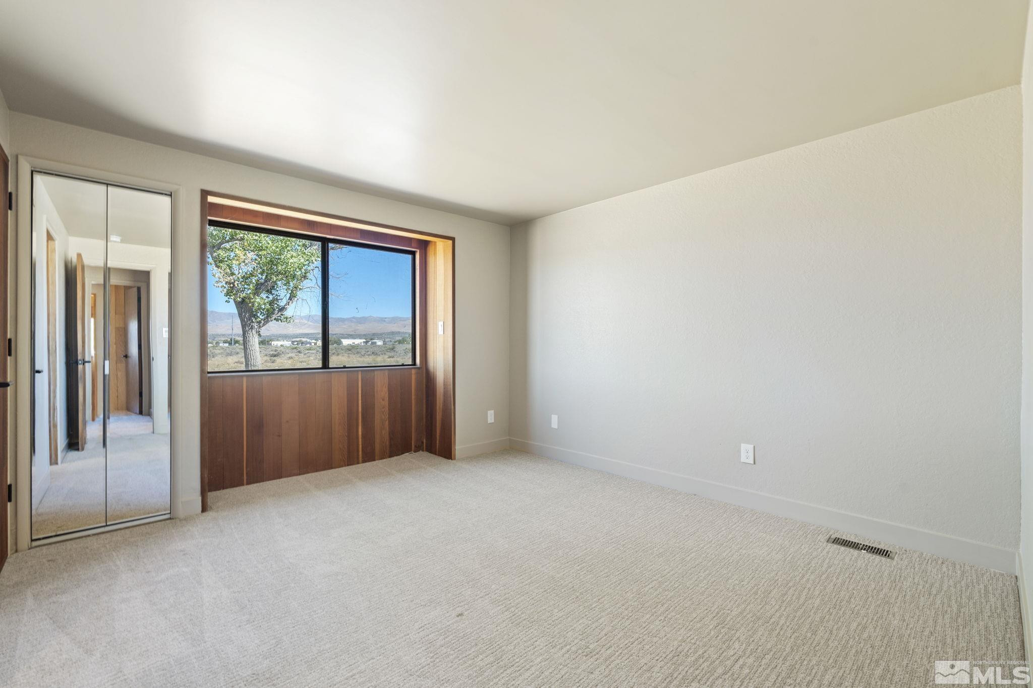 888 Dresslerville Road Gardnerville, NV 89460 - Photo 24 of 35 an empty room with windows