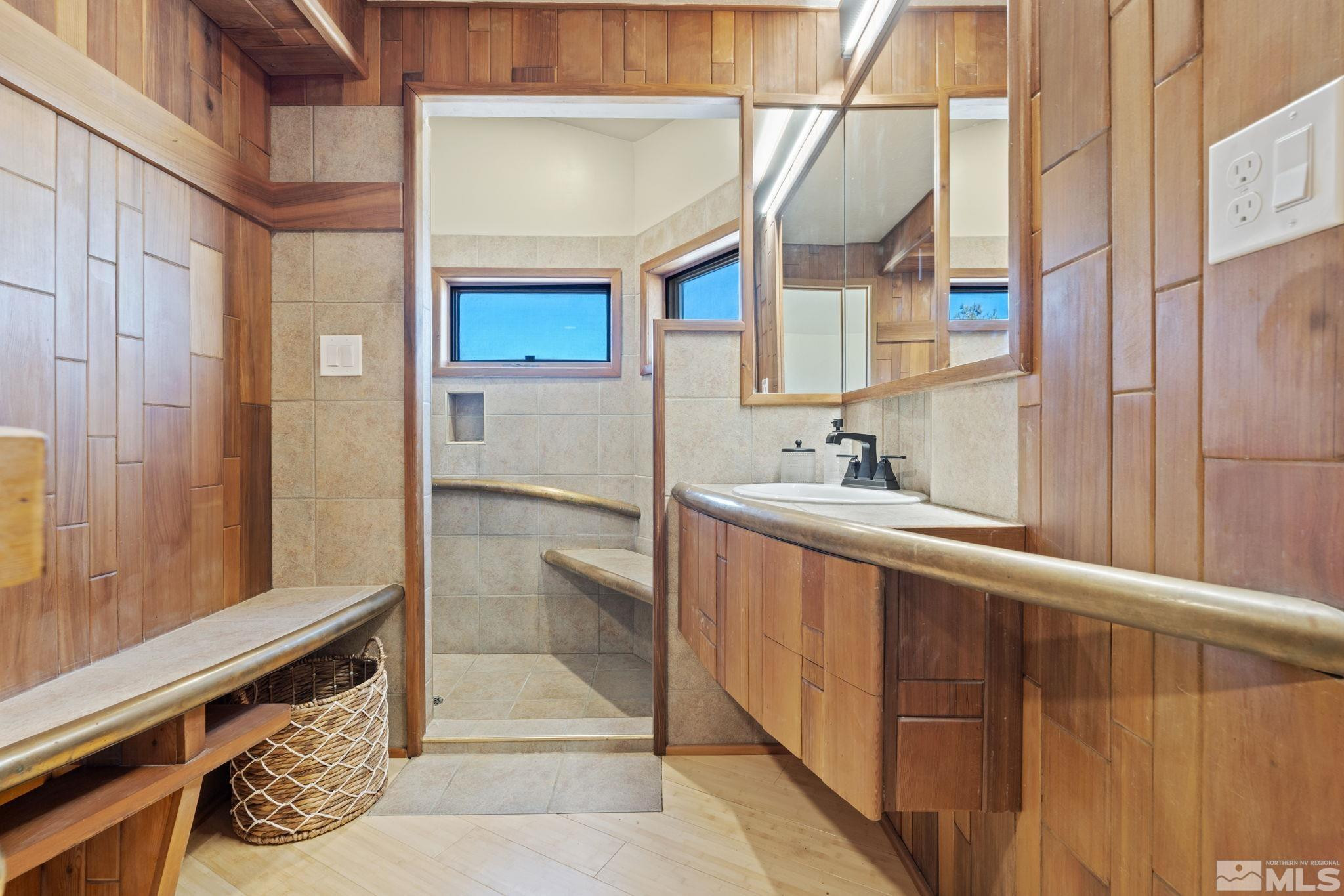 888 Dresslerville Road Gardnerville, NV 89460 - Photo 26 of 35 a bathroom with a double vanity sink and mirror