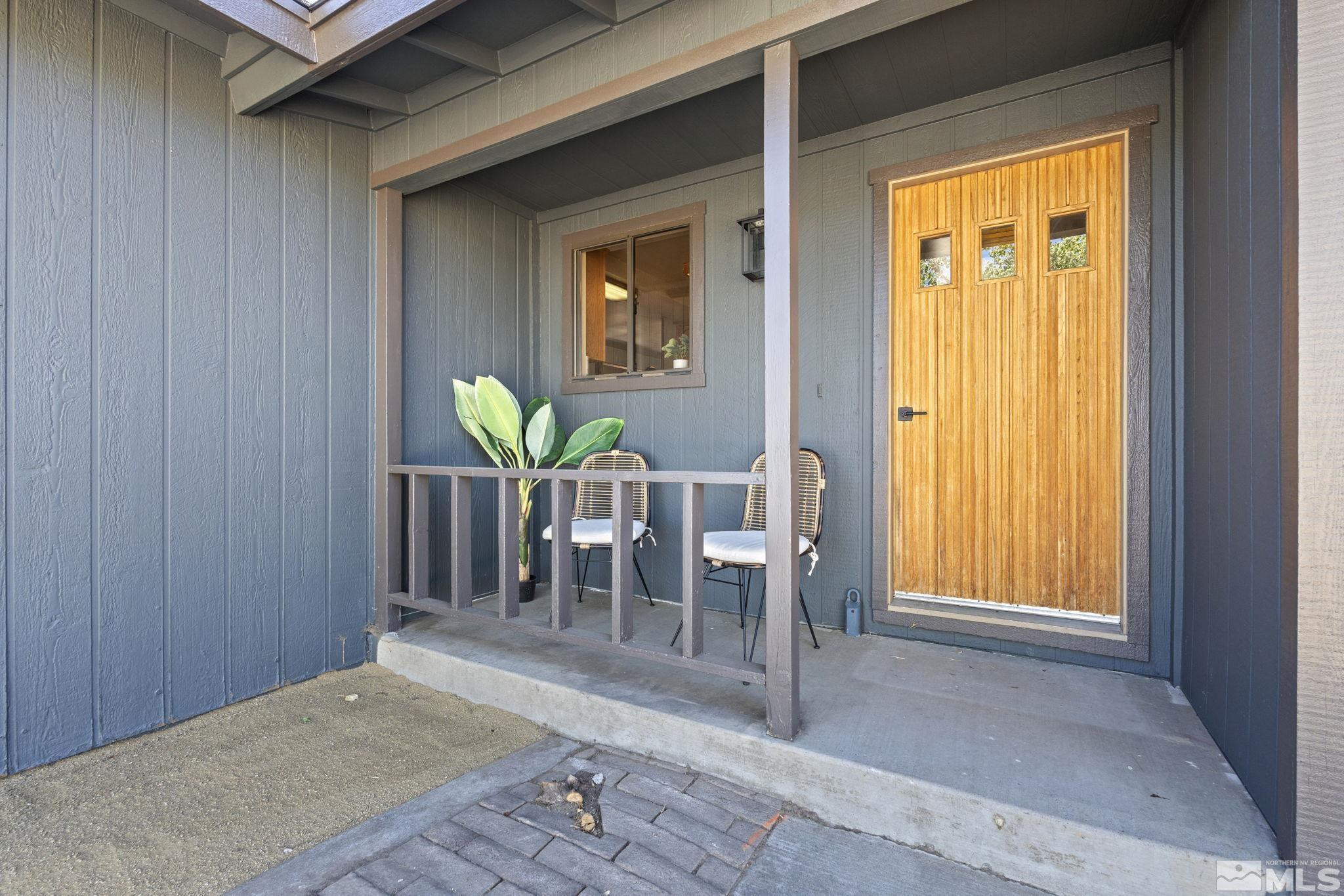 888 Dresslerville Road Gardnerville, NV 89460 - Photo 28 of 35 a view of a hallway with wooden floor and a window