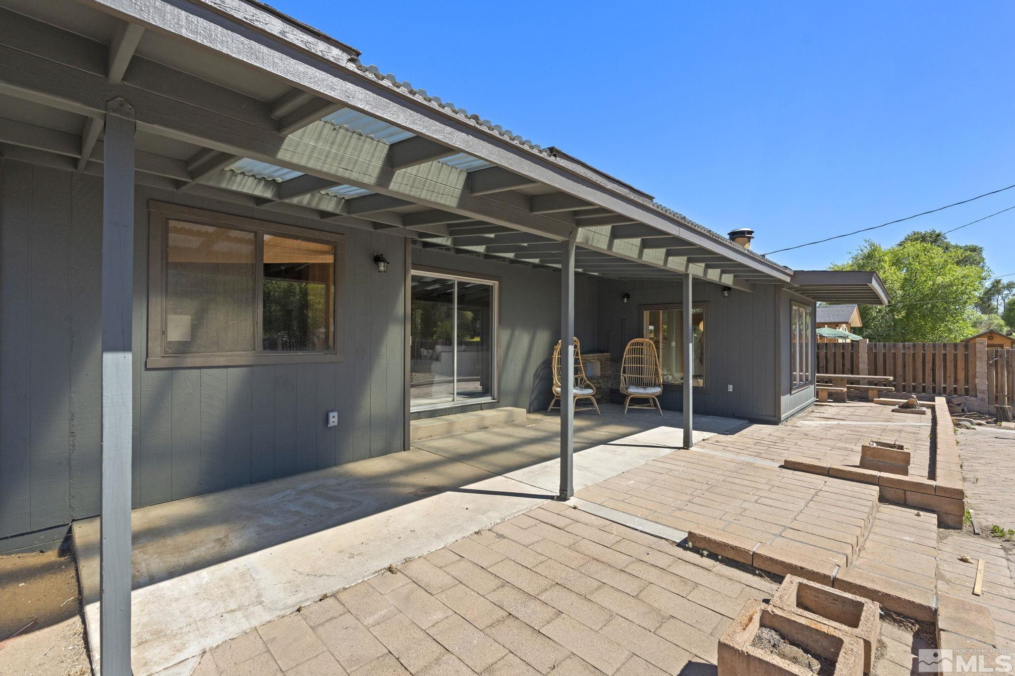 888 Dresslerville Road Gardnerville, NV 89460 - Photo 30 of 35 a patio with a table and chairs and potted plants