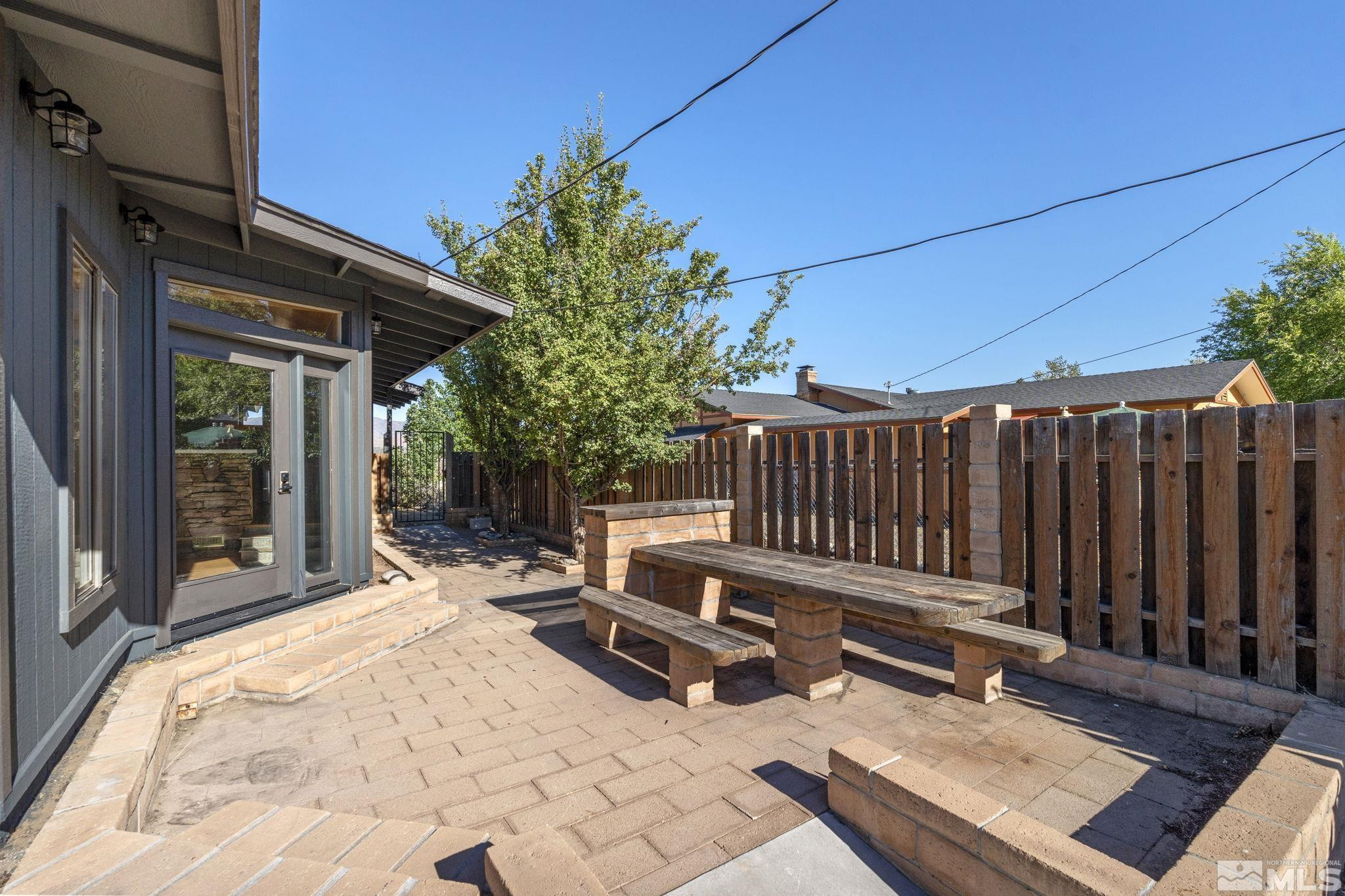 888 Dresslerville Road Gardnerville, NV 89460 - Photo 31 of 35 a view of a backyard with chairs and a patio