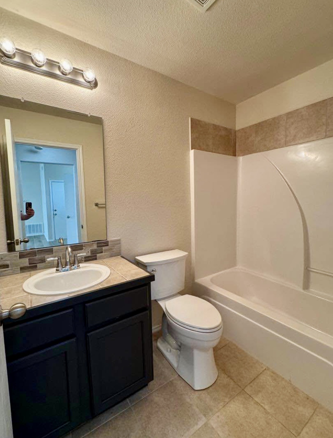 400 Blue Shale Drive Jarrell, TX 76537 - Photo 7 of 22 a bathroom with a sink and a mirror