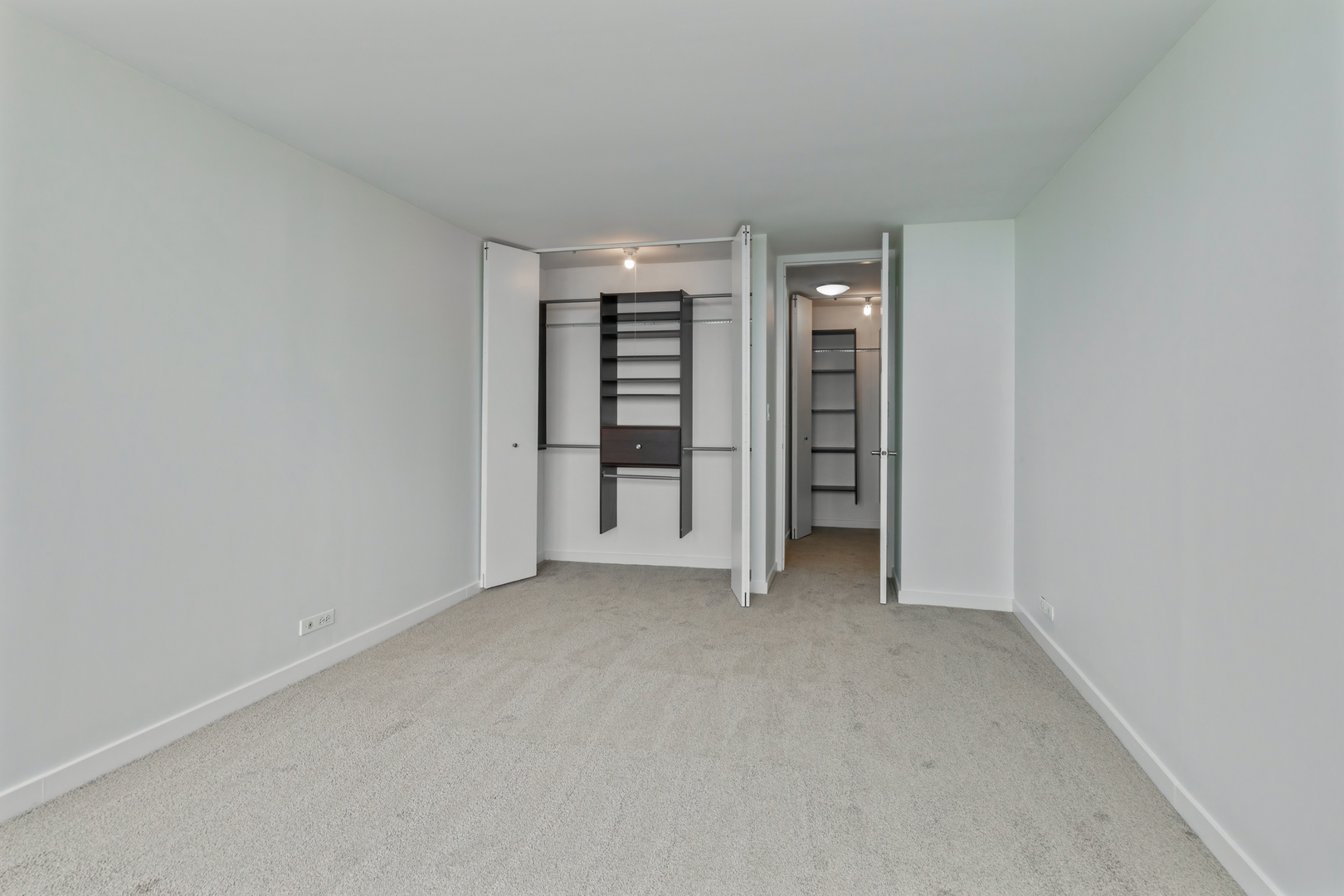 655 West Irving Park Road, Unit 4808 Chicago, IL 60613 - Photo 11 of 26 an empty room with closet and a window