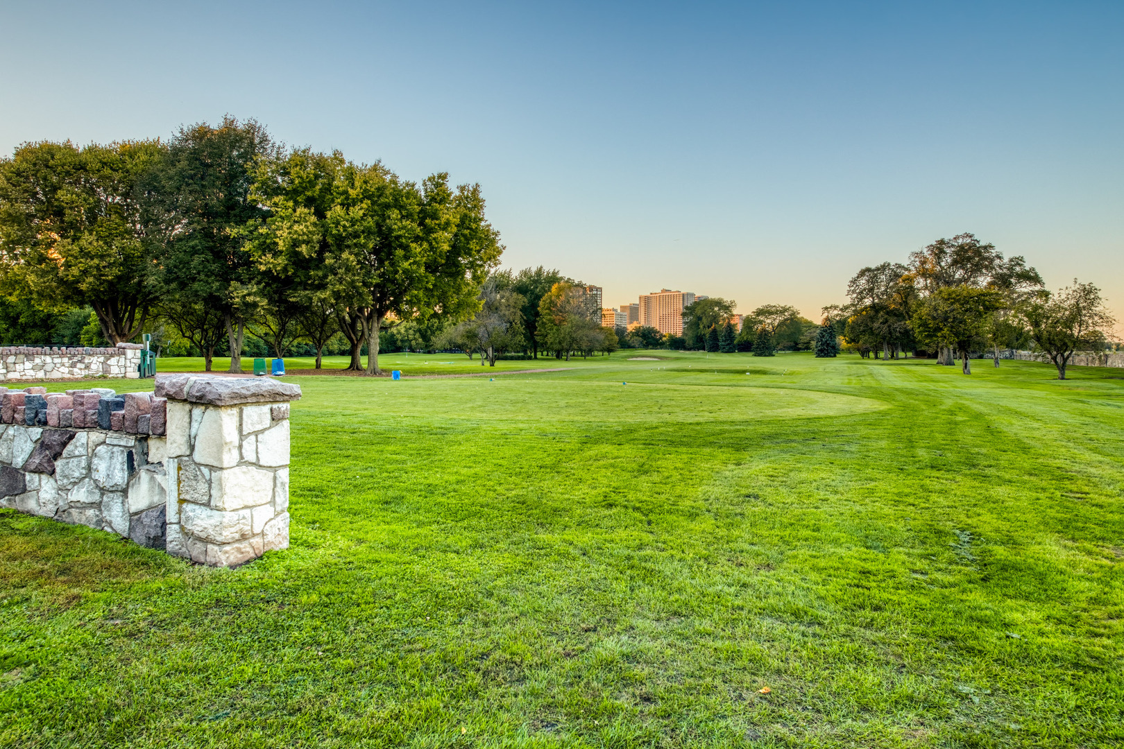 655 West Irving Park Road, Unit 4808 Chicago, IL 60613 - Photo 23 of 26 a view of a park with a bench and trees