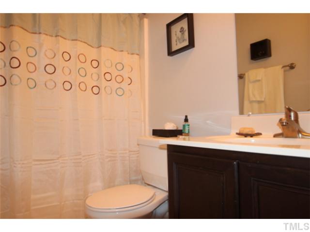 1137 South State Street Raleigh, NC 27601 - Photo 10 of 12 a bathroom with a sink and a mirror