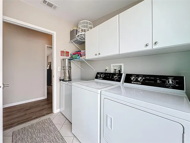 a view of a swimming pool and a back yard