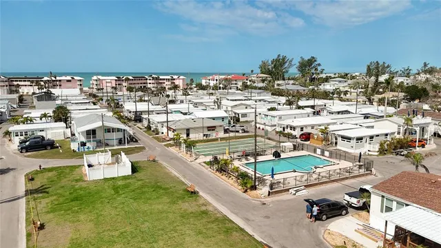an aerial view of a house with outdoor space