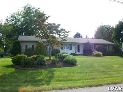 541 Bauer Road Bath, PA 18014 - Photo 1 of 8 a front view of a house with a garden