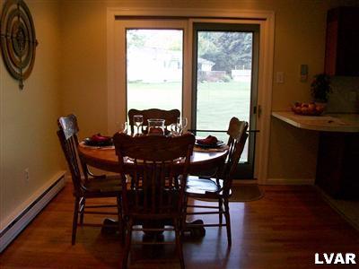 541 Bauer Road Bath, PA 18014 - Photo 4 of 8 a view of a dining room with furniture and wooden floor