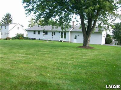 541 Bauer Road Bath, PA 18014 - Photo 7 of 8 a front view of a house with a garden