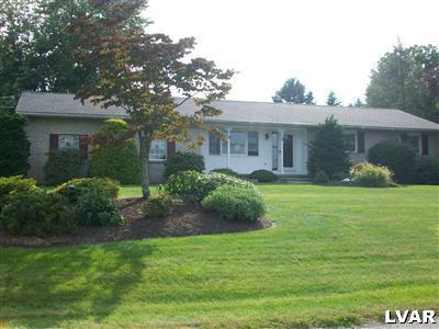 541 Bauer Road Bath, PA 18014 - Photo 8 of 8 a front view of a house with garden and trees