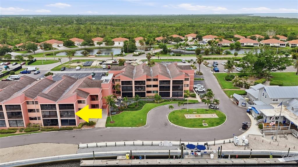 3170 Matecumbe Key Road, Unit 127 Punta Gorda, FL 33955 - Photo 19 of 22 an aerial view of residential houses with outdoor space and swimming pool