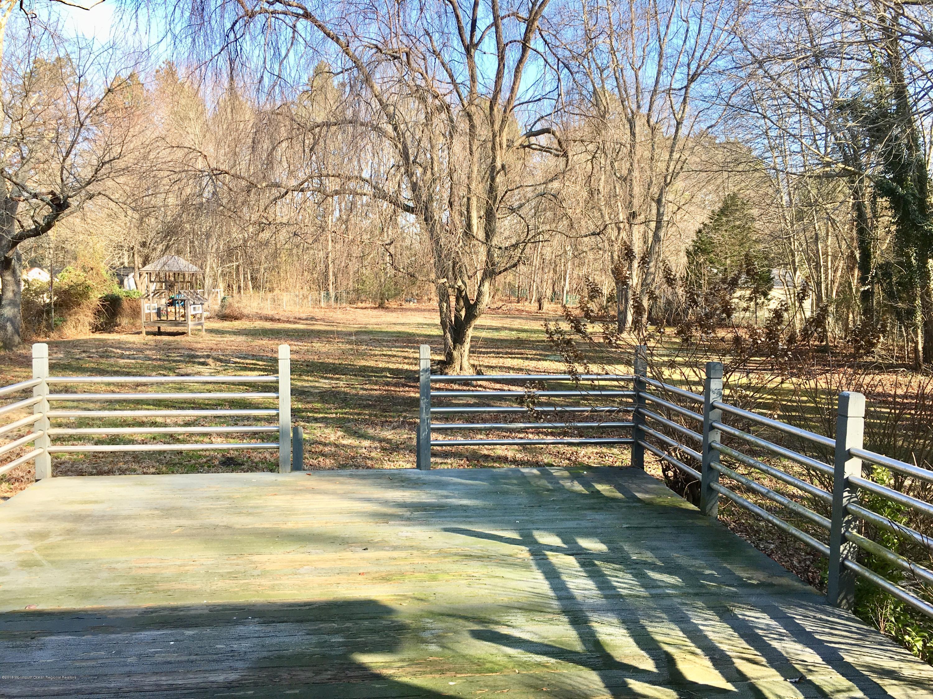 627 Leesville Road Jackson, NJ 08527 - Photo 15 of 17 a view of a swimming pool with an outdoor space