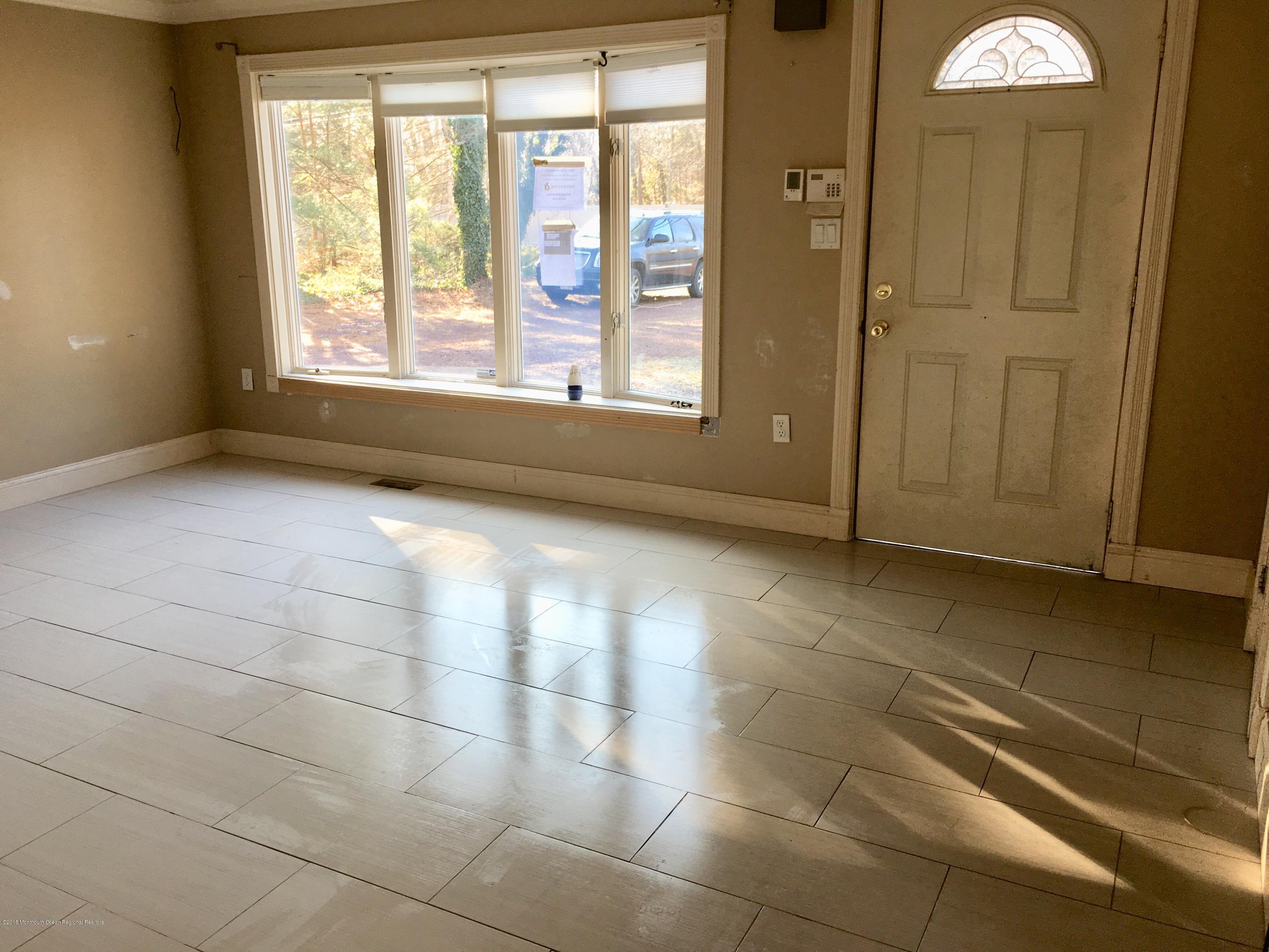 627 Leesville Road Jackson, NJ 08527 - Photo 3 of 17 a view of an empty room and window