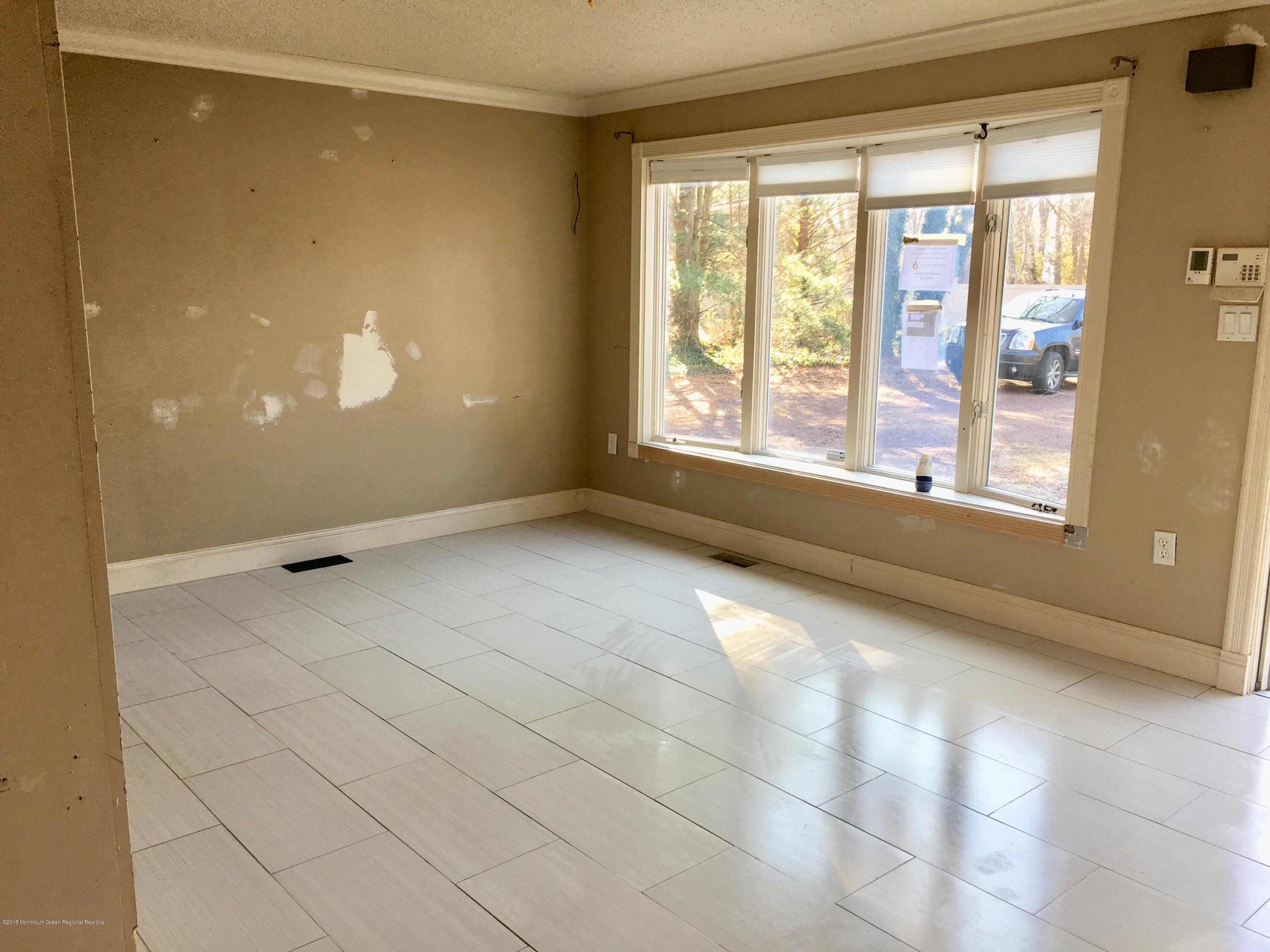 627 Leesville Road Jackson, NJ 08527 - Photo 4 of 17 a view of an empty room with a window