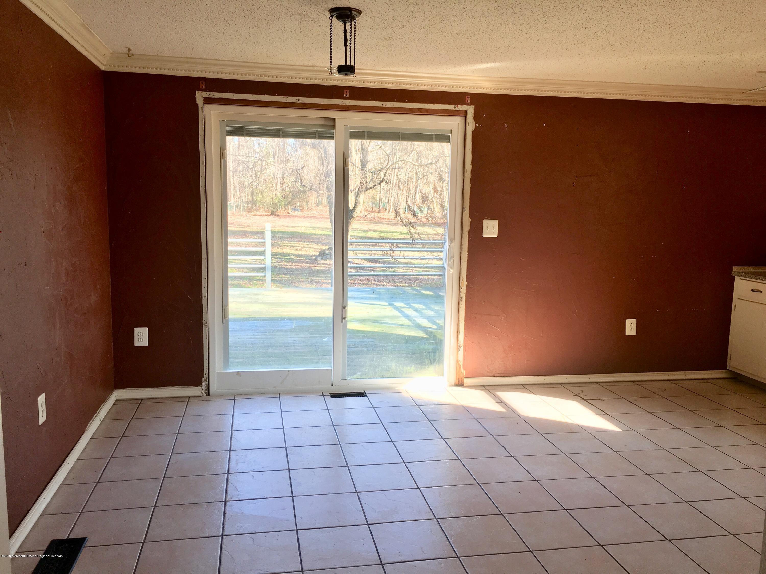 627 Leesville Road Jackson, NJ 08527 - Photo 7 of 17 a view of an empty room and window
