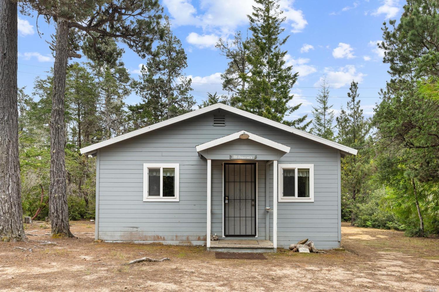 43005 Little Lake Road Mendocino, CA 95460 - Photo 1 of 1 a front view of a house with a garden