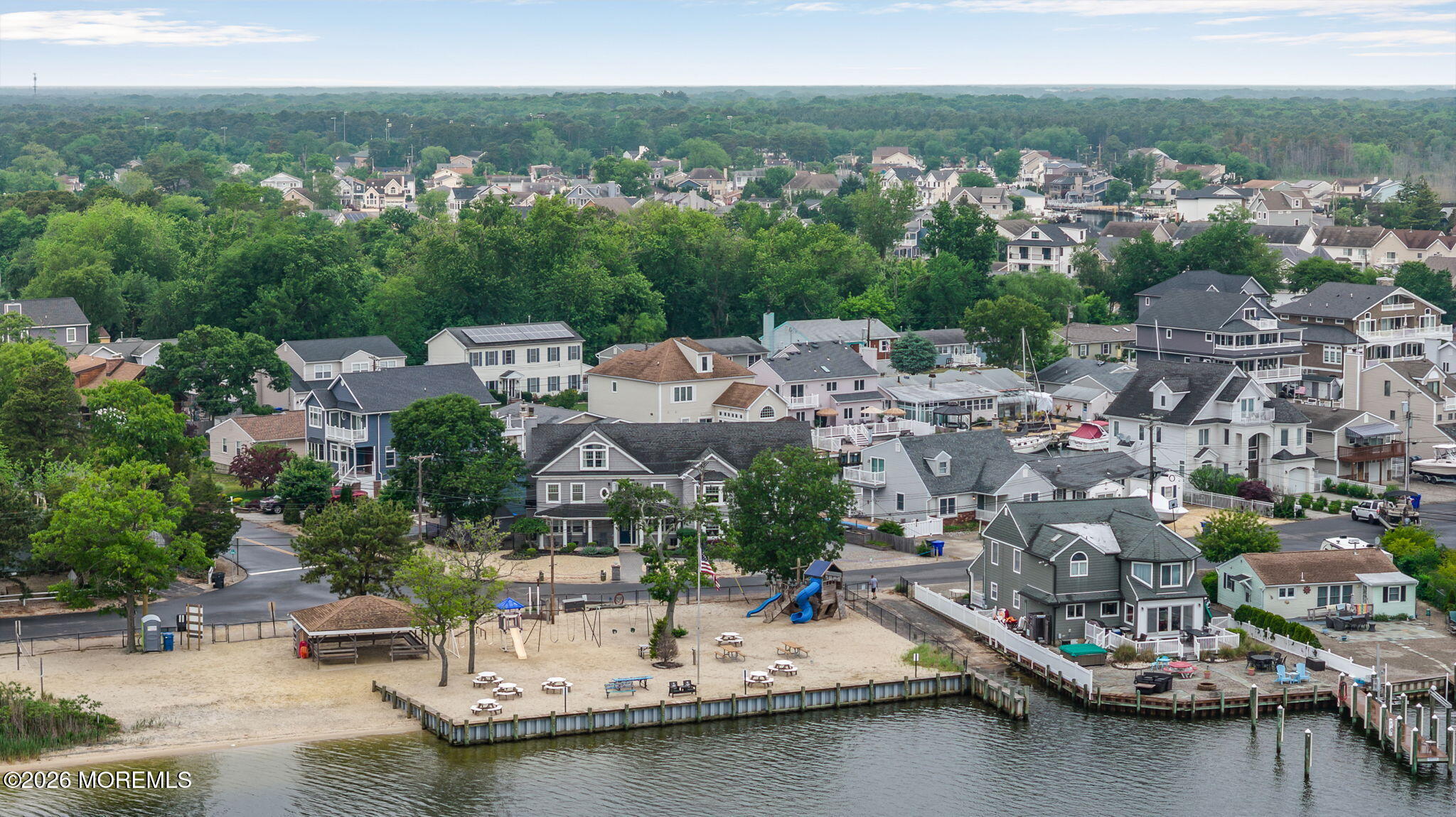 9 Cross Trees Road Brick, NJ 08723 - Photo 96 of 126 a view of a lake with a city