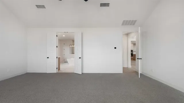 an empty room with closet area