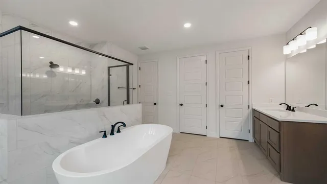 a bathroom with a bathtub and a sink