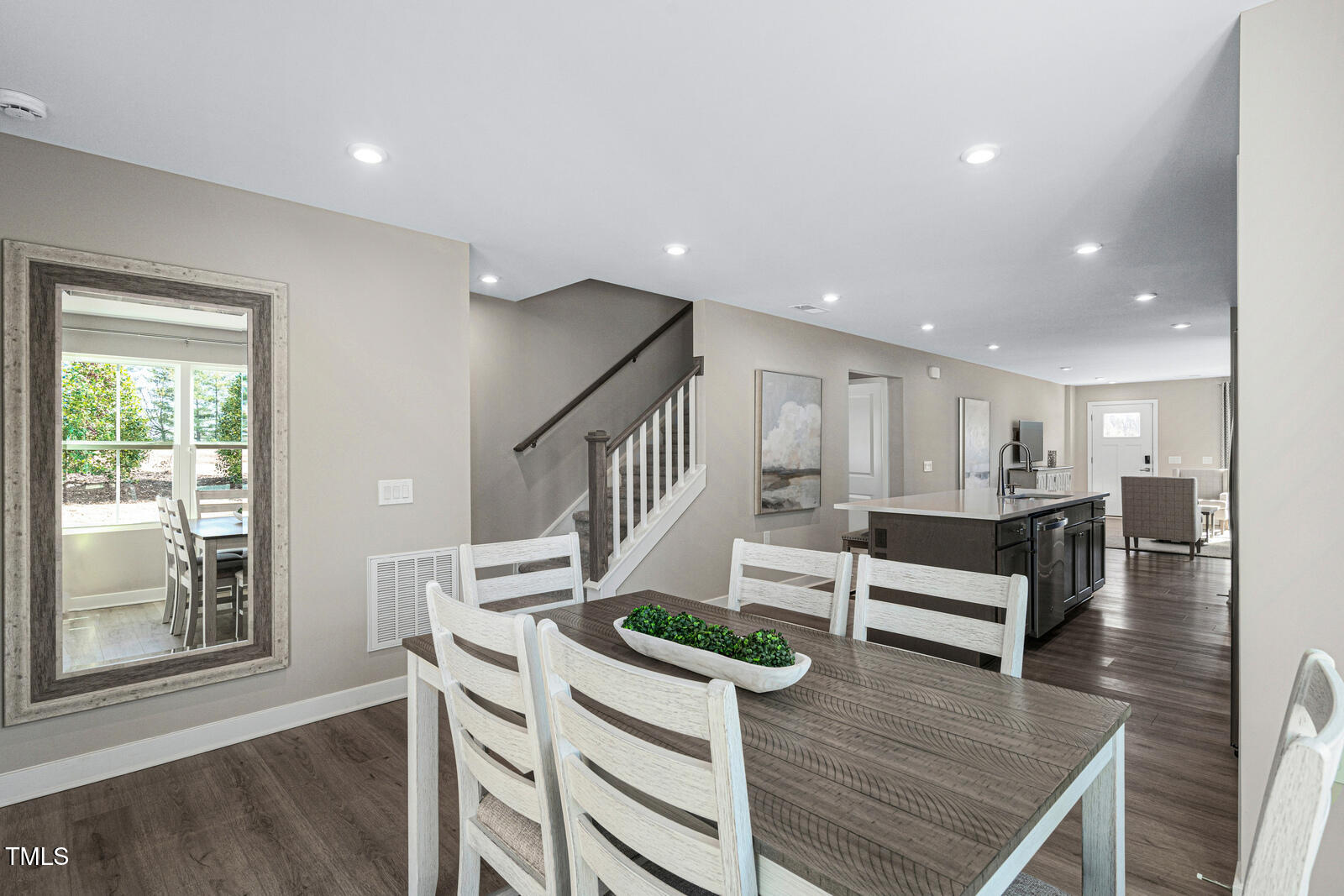 408 Grand Silo Road Raleigh, NC 27603 - Photo 11 of 25 a view of entryway kitchen and hall with wooden floor