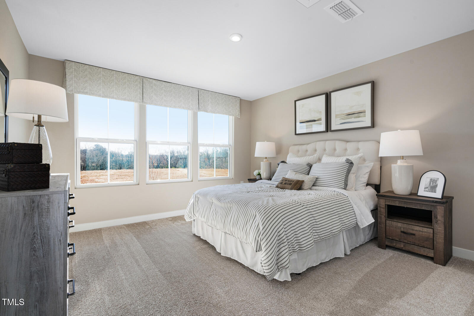 408 Grand Silo Road Raleigh, NC 27603 - Photo 23 of 25 a bedroom with a bed and a tv