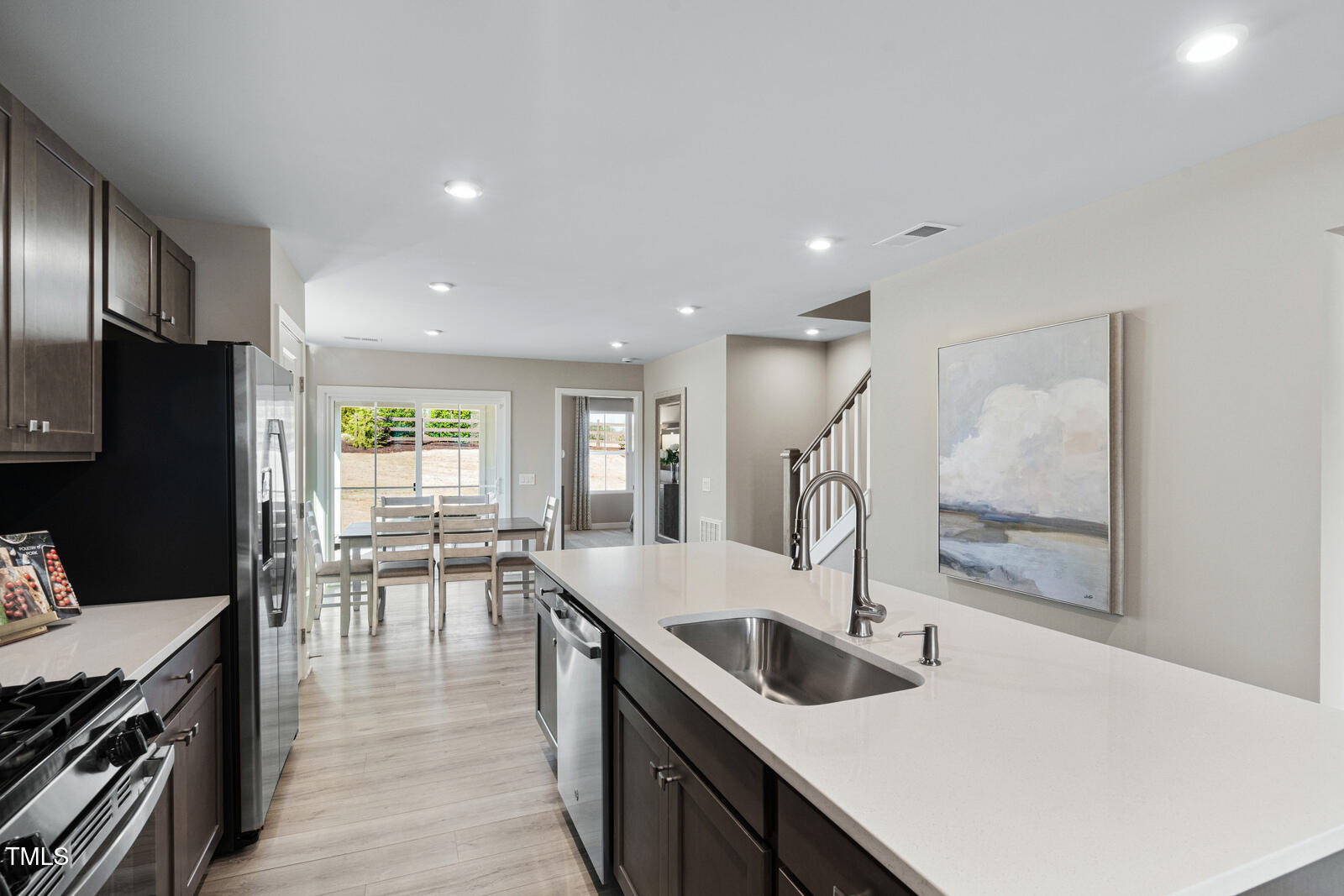 408 Grand Silo Road Raleigh, NC 27603 - Photo 5 of 25 a kitchen with counter top space cabinets and stainless steel appliances