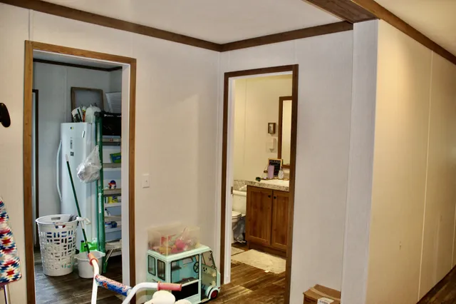 a bathroom with a sink vanity mirror and toilet