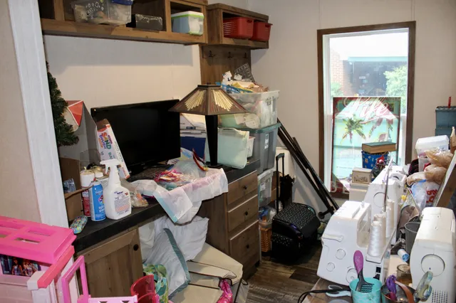 a hallway with a dining table and chairs