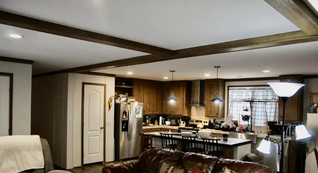 a very nice looking living room with furniture and a large window