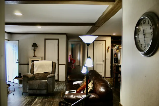 a living room with furniture and a chair