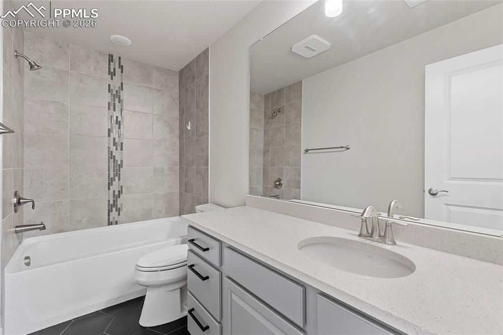 15777 Little Bluestem Road Monument, CO 80132 - Photo 32 of 50 a bathroom with a sink a toilet and shower