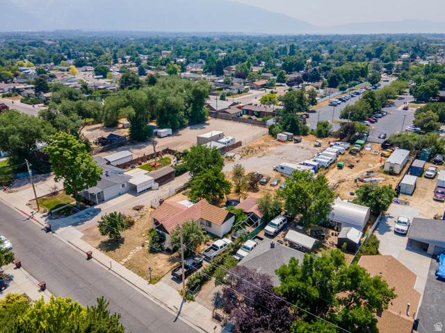 72 Cox Lane Midvale, UT 84047 - Photo 4 of 16 Aerial perspective showcasing a residential street with diverse property types