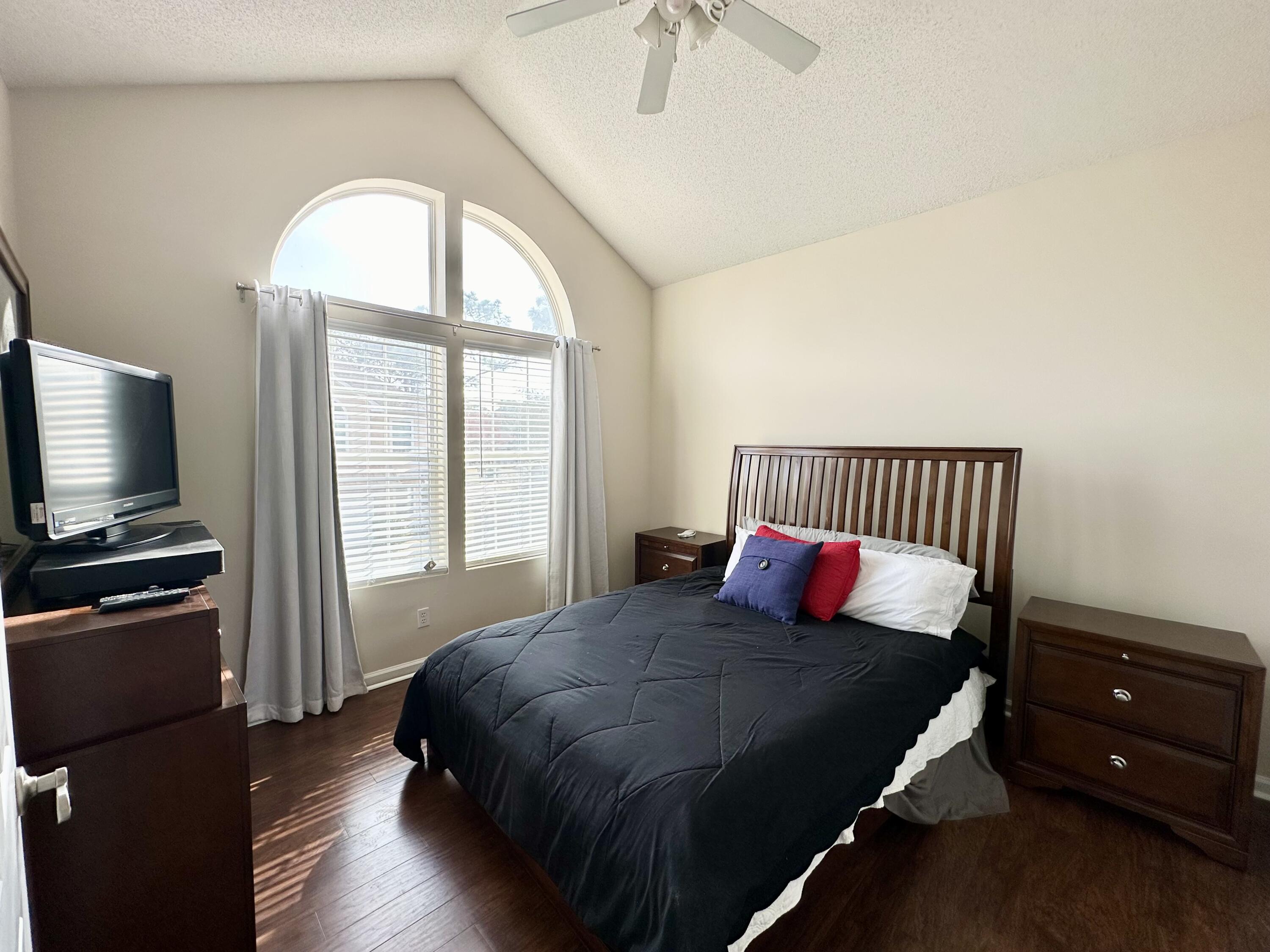 732 East Mack Bayou Drive, Unit 2 Santa Rosa Beach, FL 32459 - Photo 29 of 43 a bedroom with a bed and a flat tv screen on dresser