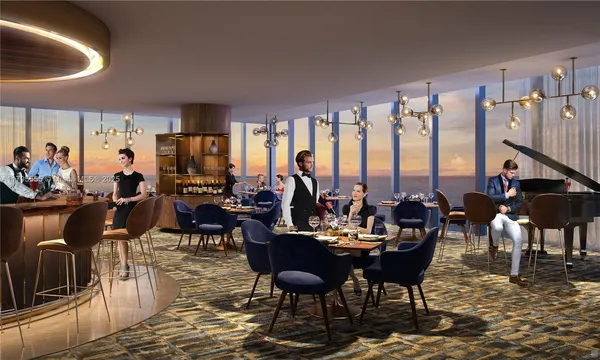 a living room with furniture a rug and a chandelier