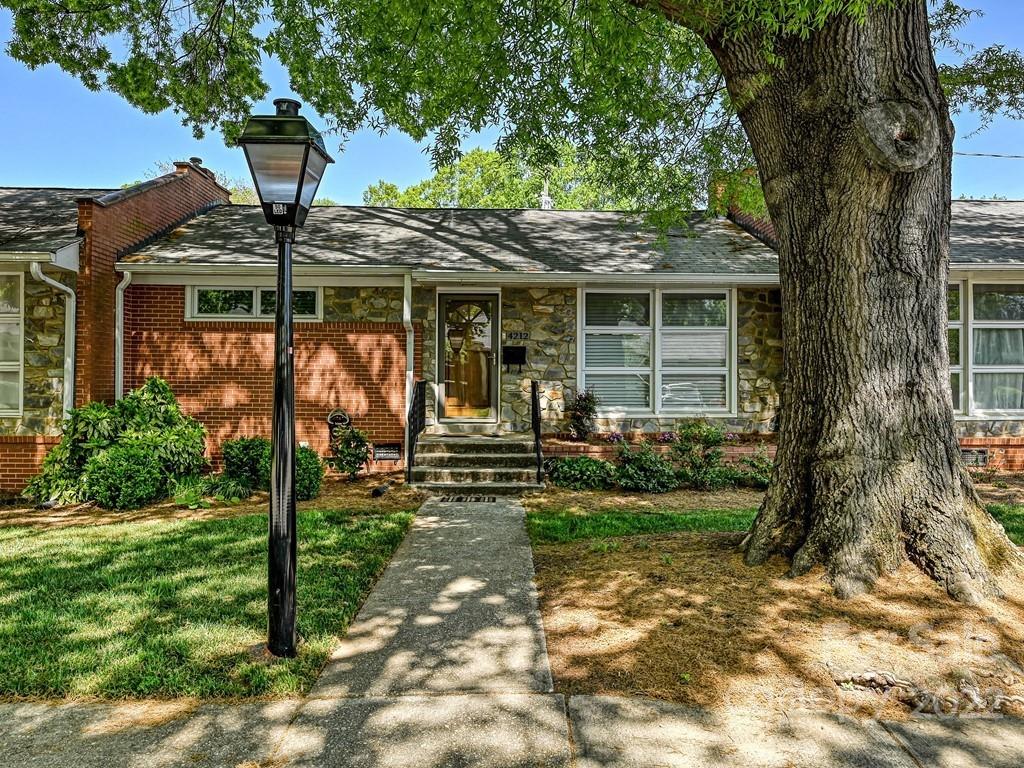 4212 Randolph Road Charlotte, NC 28211 - Photo 1 of 23 a front view of a house with garden