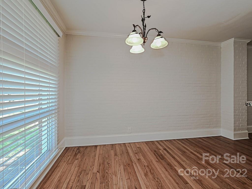 4212 Randolph Road Charlotte, NC 28211 - Photo 12 of 23 a view of a room with wooden floor and fan