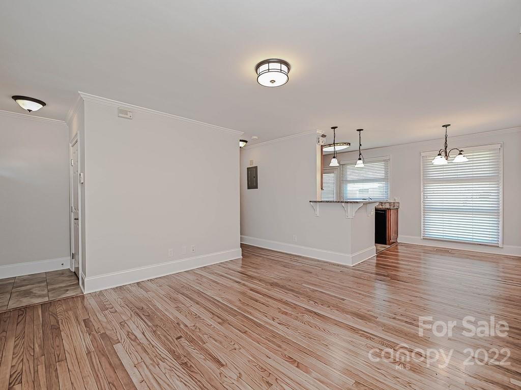 4212 Randolph Road Charlotte, NC 28211 - Photo 14 of 23 a view of empty room with wooden floor and fan