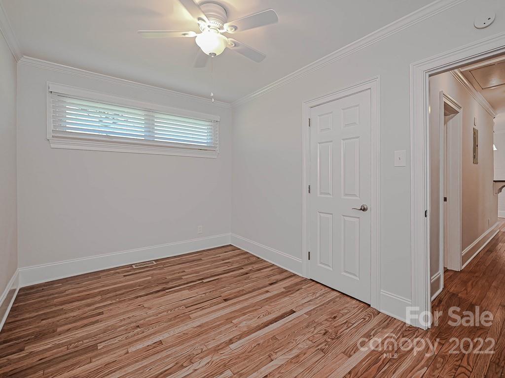4212 Randolph Road Charlotte, NC 28211 - Photo 21 of 23 a view of a room with wooden floor and fan