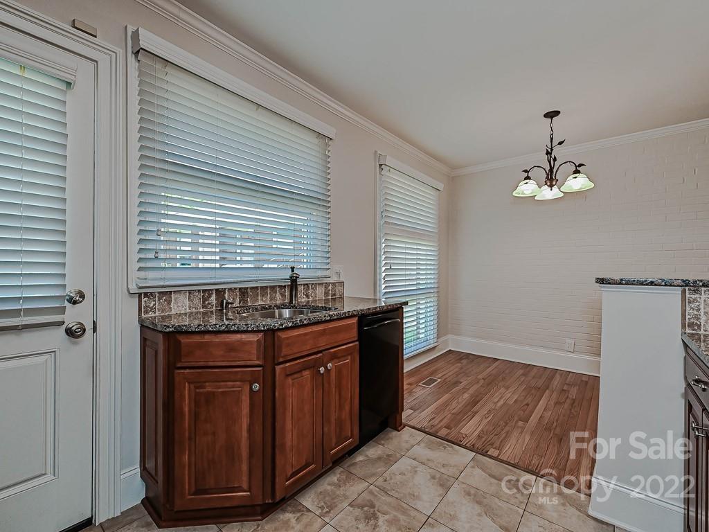 4212 Randolph Road Charlotte, NC 28211 - Photo 10 of 23 a kitchen with a wooden cabinets and stove