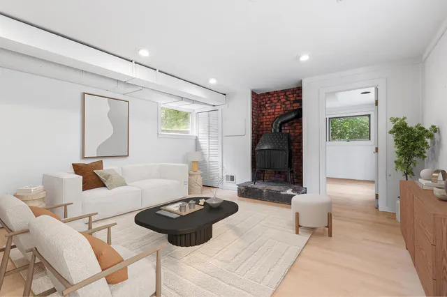 a living room with furniture and flowers