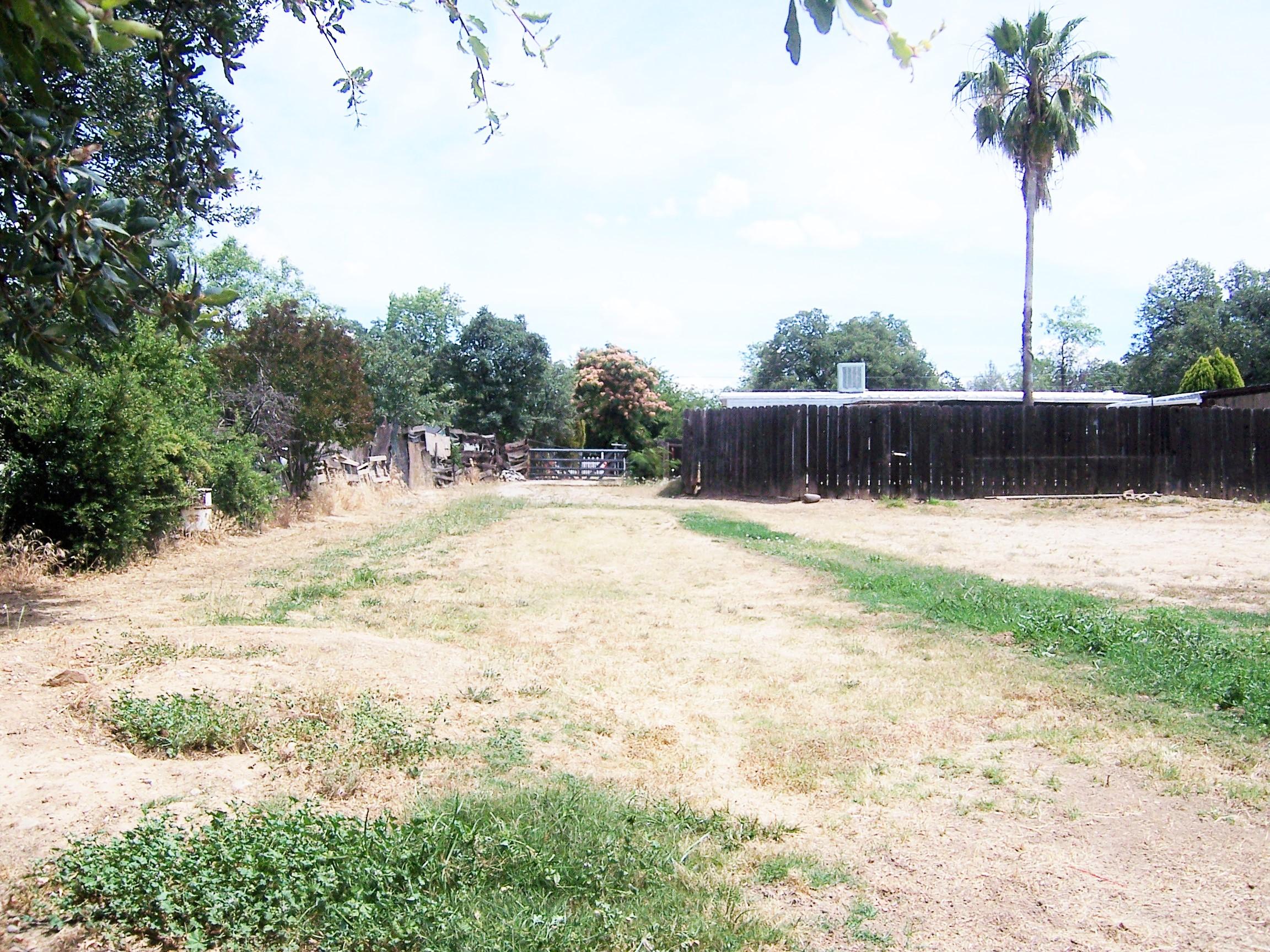 Scott Road Redding, CA 96003 - Photo 11 of 22 a swimming pool with a lawn chairs under an umbrella