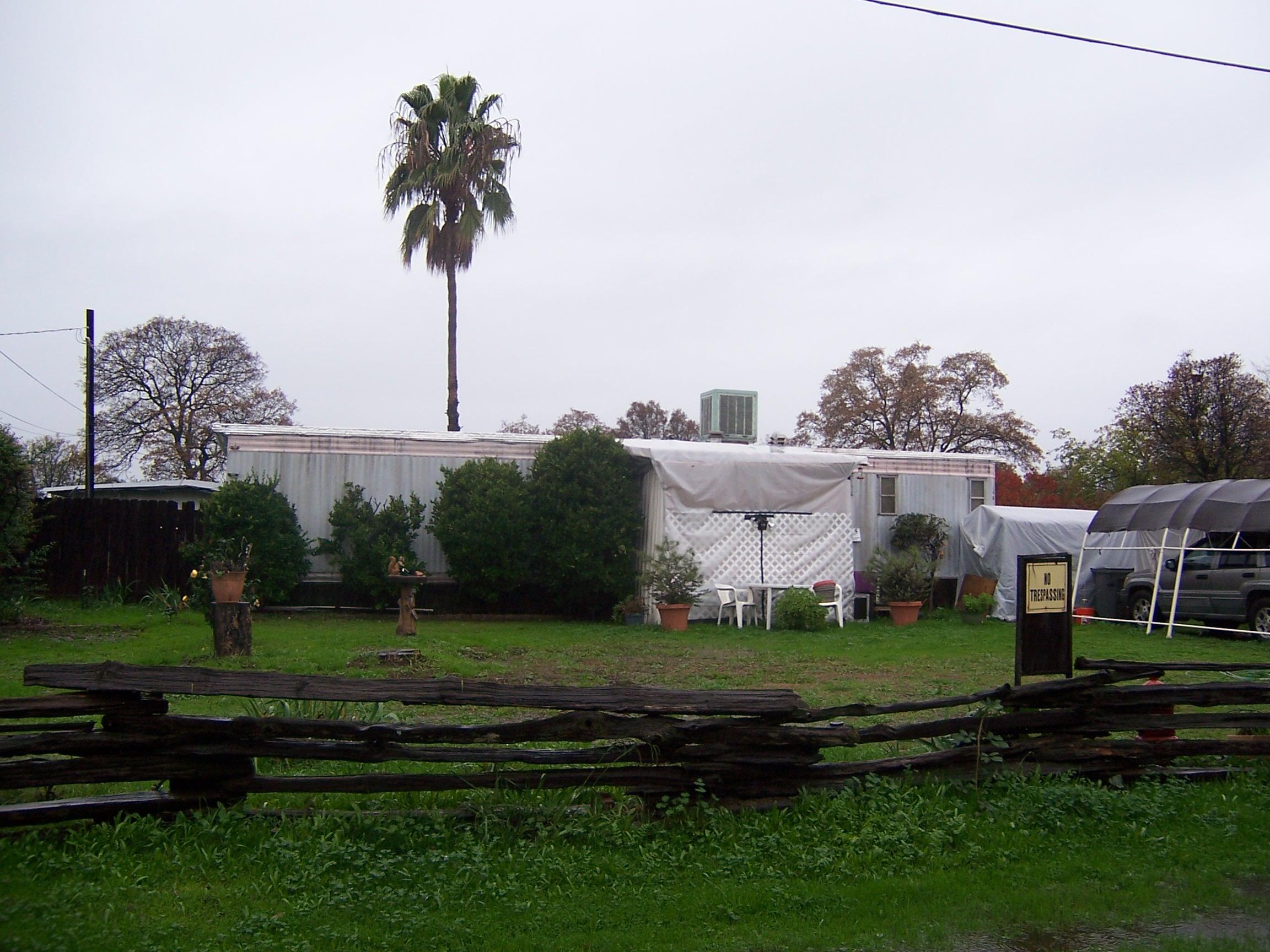 Scott Road Redding, CA 96003 - Photo 15 of 22 a view of a garden with a building in the background