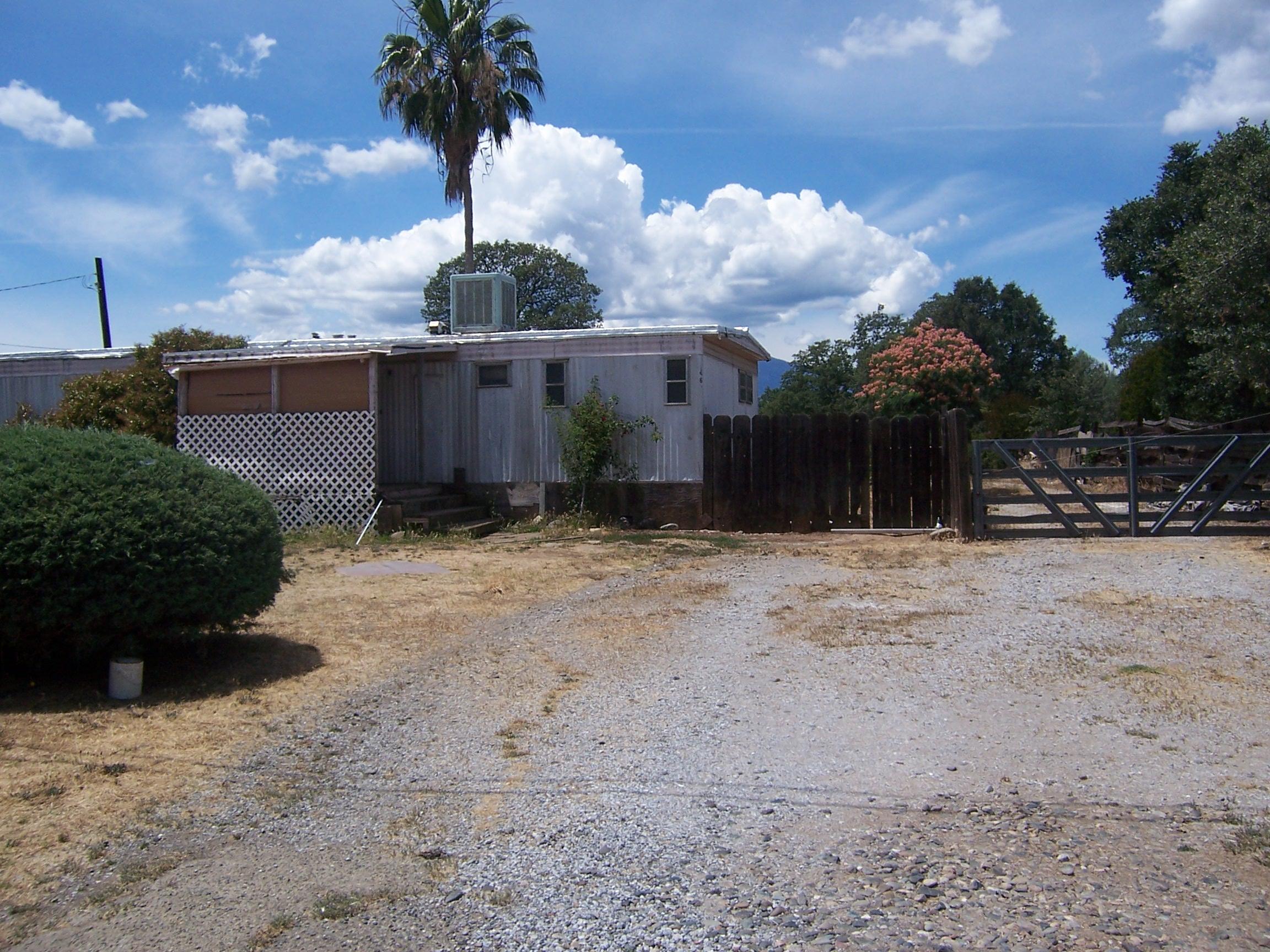 Scott Road Redding, CA 96003 - Photo 4 of 22 a front view of a house with a yard