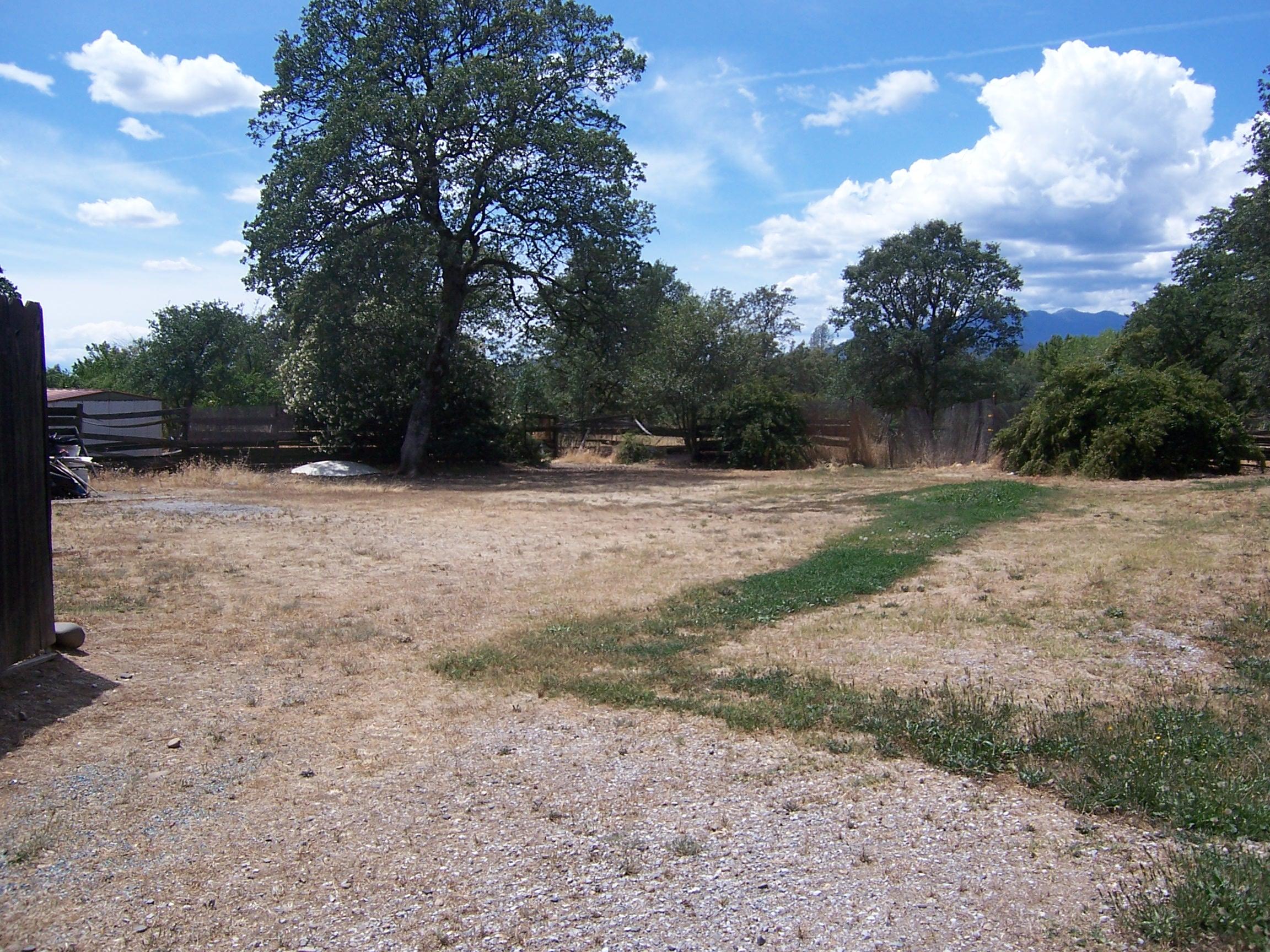 Scott Road Redding, CA 96003 - Photo 7 of 22 a backyard of a house with lots of green space
