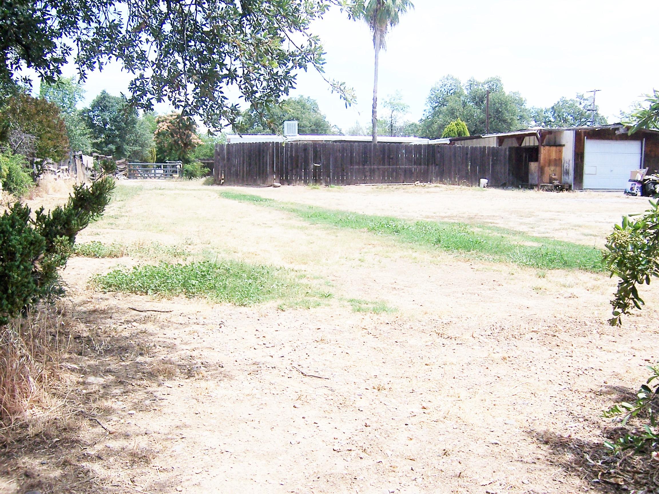 Scott Road Redding, CA 96003 - Photo 9 of 22 a swimming pool with a wooden fence